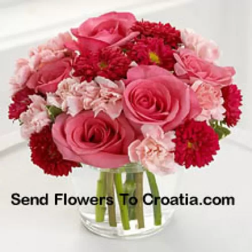 7 Pink Roses, 10 Red Colored Daisies And 10 Pink Colored Carnations In A Glass Vase